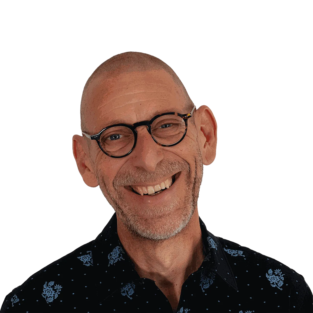 Denis Jaccard, souriant, lunettes rondes et chemise sombre